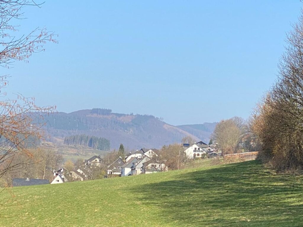 Mountains in Wiemeringhausen during the summer with the village on the background